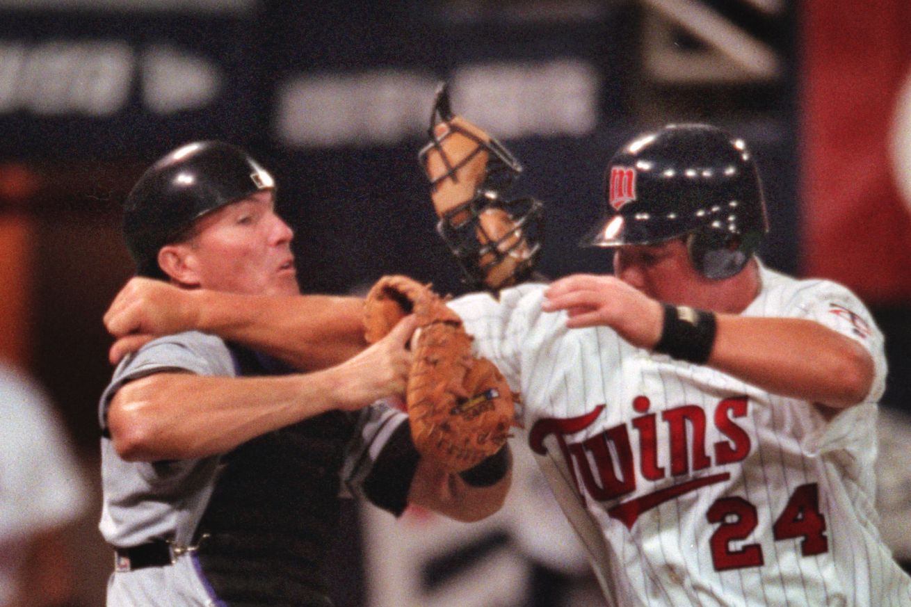 MINNEAPOLIS - 4/3/00 - The Twins kicked off their 40th season against the Tampa Bay Devil Rays Monday night at the Metrodome. — The Twins Matt LeCroy comes up short on an attempt to score at home off of second on the third inning. Tampa Bay Devil Rays ca